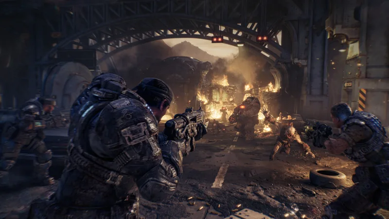 Three COG soldiers fire rifles toward burning wreckage and a Locust under a steel bridge