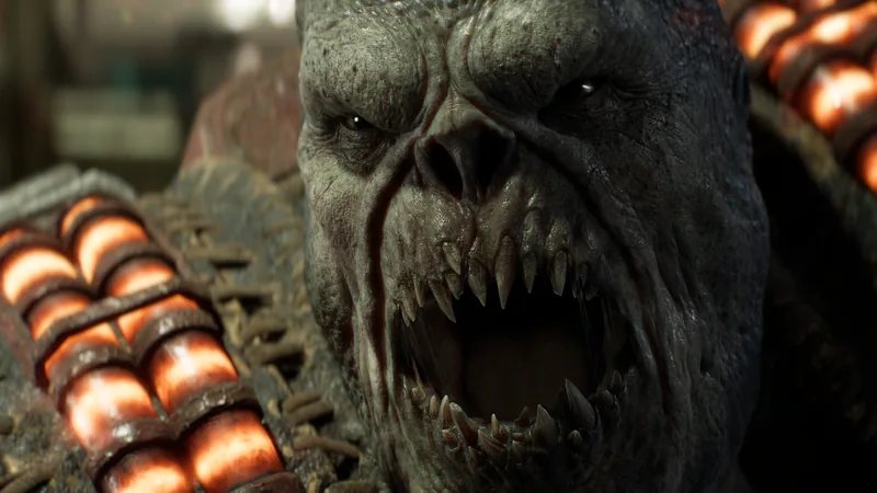 Close-up of a snarling Locust with pale skin and glowing ammunition belts across its shoulders